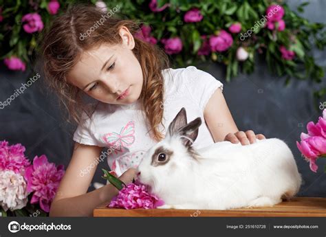 Little Girl Playing With Real Rabbit Child And White Bunny On E Stock