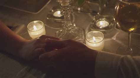 Couple Holding Hands At Candle Lit Dinner Filmpac