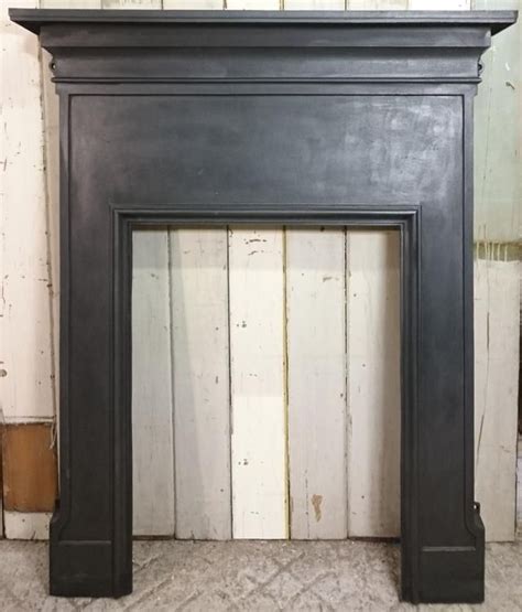 Reclaimed white pine fire surround with classical ribbons, bows and swags with acanthus topped reeded side columns. FS0028 A Small Reclaimed Antique Cast Iron Fire Surround ...