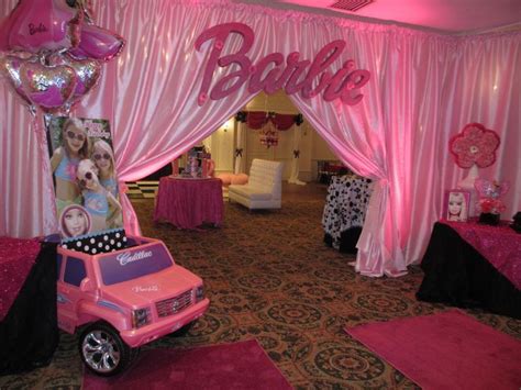 A Pink Barbie Themed Party With Balloons And Decorations On The Walls