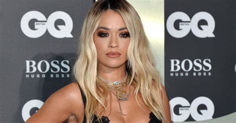 rita ora suffers wardrobe malfunction as she flashes her underwear in high slit red gown at