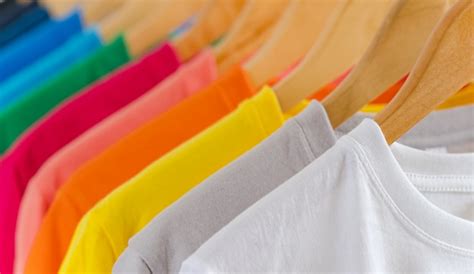 Premium Photo Close Up Of Colorful T Shirts On Hangers Apparel