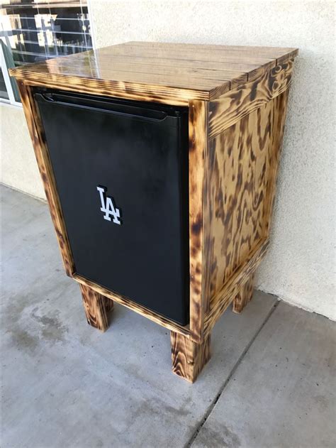 Not only is the mini fridge cabinet totally gorgeous, but oh so functional too! Glossy burnt wood mini fridge cabinet | Outdoor fridge cabinet, Mini fridge cabinet, Outdoor ...
