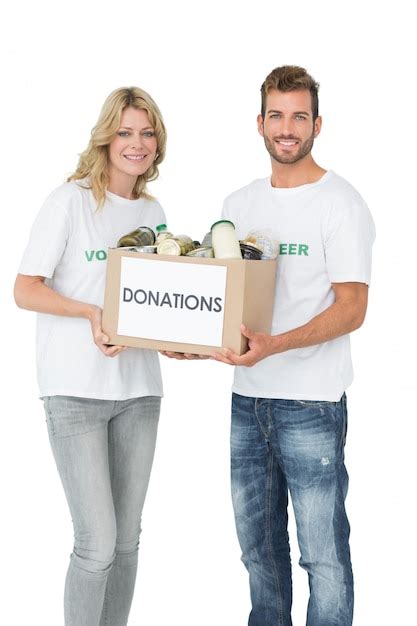 Premium Photo Smiling Young Couple Carrying Donation Box