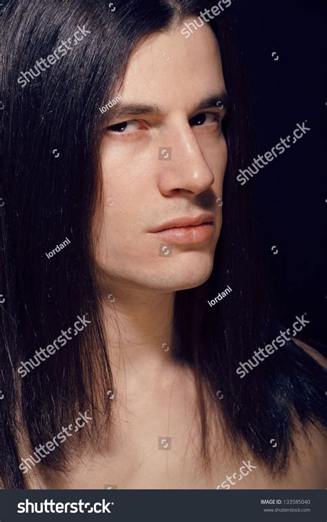 Portrait Of Handsome Man With Long Hair Torso Naked On Black Background Stock Photo