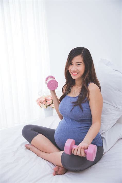Beautiful Asian Pregnant Woman Doing Exersice On Her Bed Stock Image Image Of Healthy Beauty