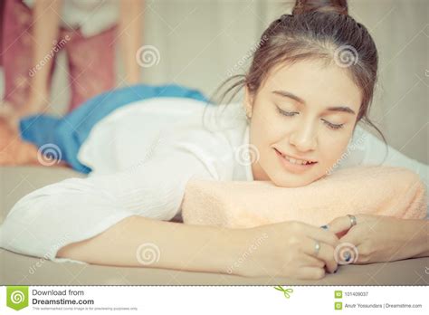 Women With Closed Eye Smiling While Taking Thai Massage