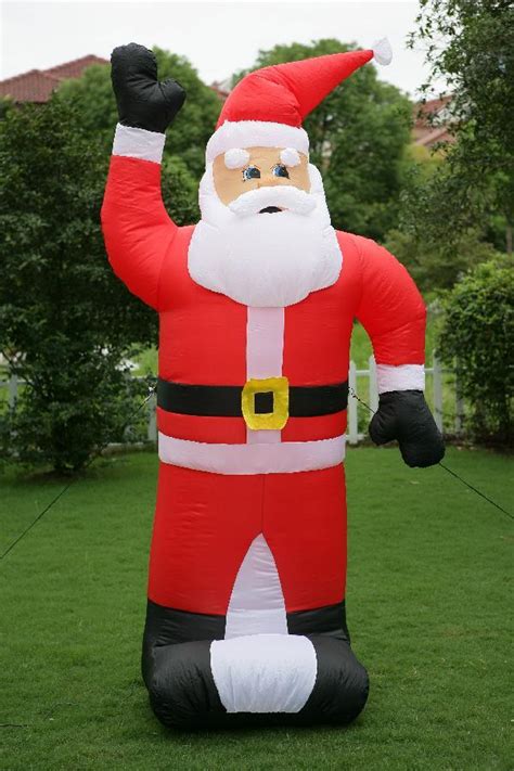 Snow covering christmas decorations on front lawn. Inflatable Christmas Decorations @BBT.com