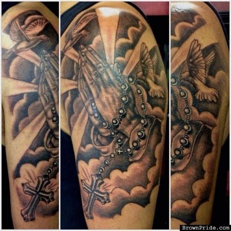 A dove printed over a praying hands tattoo with a rosary. Pin on Inked