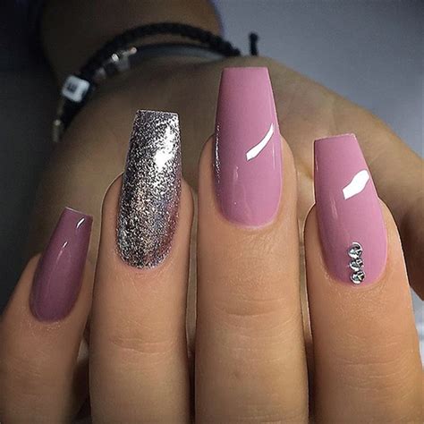 30+ Elegant Purple Glitter Coffin Nails Inspirations +Tips Our deep purple acrylic with silver glitter fades by laura denton nails bylaura im s availabl purple acrylic nails purple glitter nails purple and silver nails.