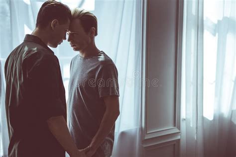 Loving Gay Couple Having Private Intimate Moment At Home Stock Image
