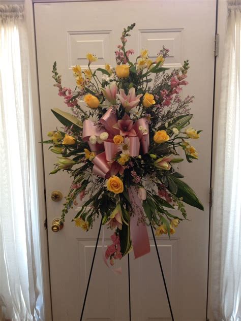 When choosing a floral arrangement, pick her favorite flower or color and. Standing spray in spring colors. | Funeral flowers, Floral ...