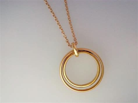 Gold ring pendant using two wedding bands. A commission to ...