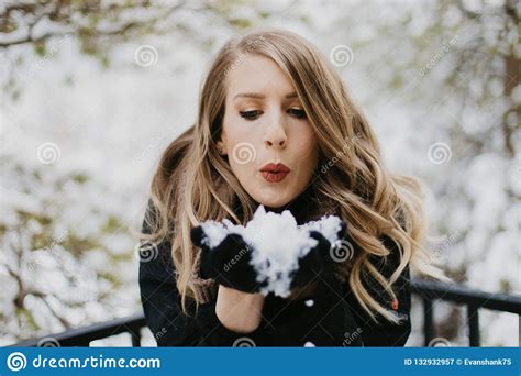 Beautiful Young Woman Modeling Bundled In Trendy Gloves Coat And