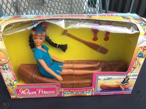the doll is in its box and has accessories for it to be used as a boat