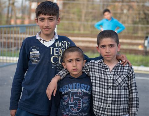 Young Refugee Boys Stop For A Photograph Life Inside Serbias Migrant