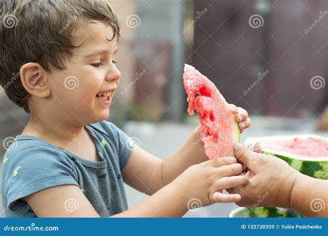 Funny Kid Eating Watermelon Outdoors In Summer Park Focus On Eyes