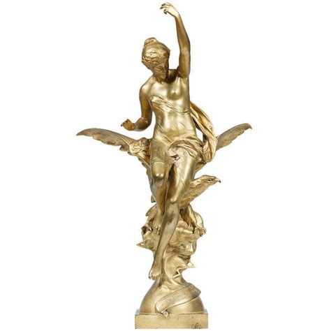 An Ormolu Sculpture Of A Nude Female Seated On The Wings Of An Eagle By