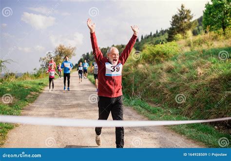 Runner Crossing Finish Line Stock Photos Download 598 Royalty Free Photos