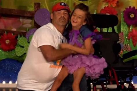 Dad Scoops Disabled Daughter From Her Wheelchair To Perform