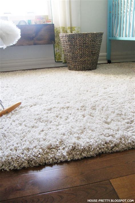 You'll get the chance to bring your personality to bear on your living space with two key black rugs look striking on pale carpet but blend in with darker flooring. white area rug over dark wood floors | For the Home ...