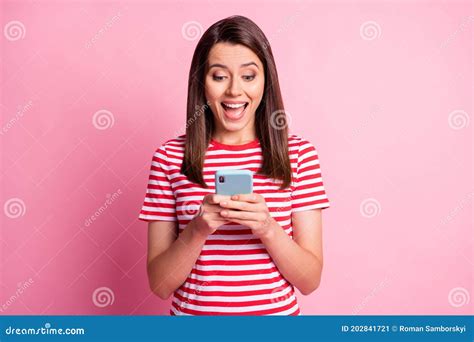 Portrait Of Excited Girl Looking Phone Smiling Wear Read White T Shirt