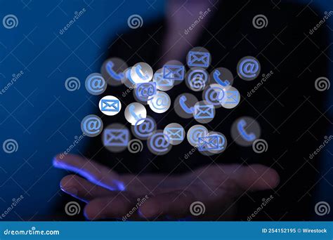 Closeup Of Email Icons Hovering Over A Female Hand Email And