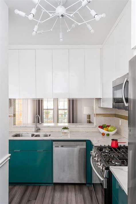 A wall of windows let chefs and guests enjoy the spectacular view of the san francisco bay, but the lack of upper cabinets means that the lower. Peacock blue lacquered cabinets | Diy kitchen remodel ...
