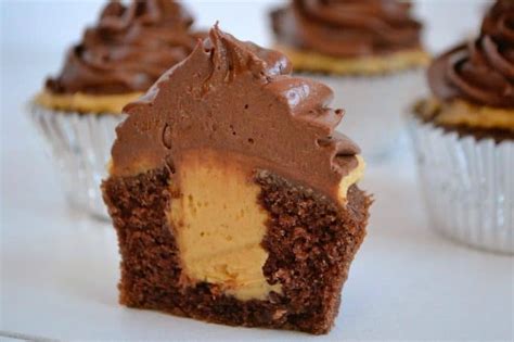 Using a mixer, beat together the butter, confectioners' sugar and marshmallow fluff. Double Chocolate Peanut Butter Filled Cupcakes
