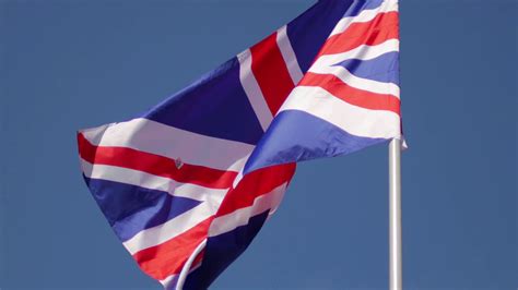 The Flag Of United Kingdom Develops Against Stock Footage Sbv 323597763