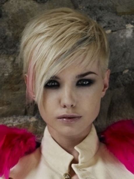 Trim the hair from the side and create shape your bangs with the shears. Pixie haircut with long bangs
