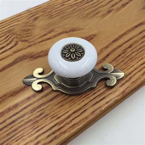 Great savings & free delivery / collection on many items. Antique Bronze Base White Ceramic Drawer Knob Cupboard ...