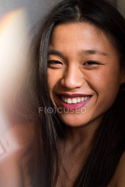 Portrait Of Young Attractive Asian Woman Smiling To Camera — Looking