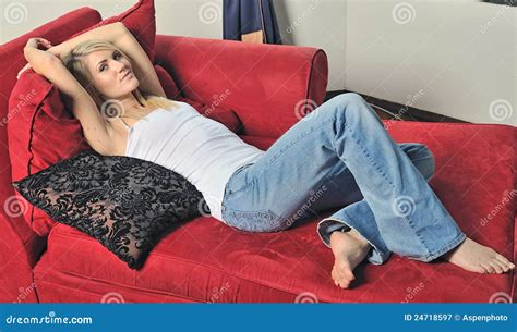 Blonde Woman Relaxing On Red Couch Stock Image Image Of Chaise Female 24718597