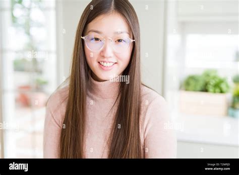 Beautiful Asian Woman Wearing Glasses With A Happy And Cool Smile On