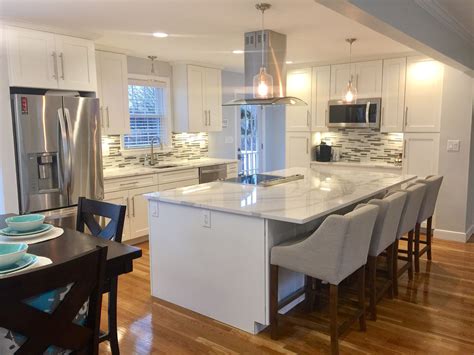 Everything you need to know about engineered quartz countertops. Open floor plan. White kitchen. Quartz countertops ...