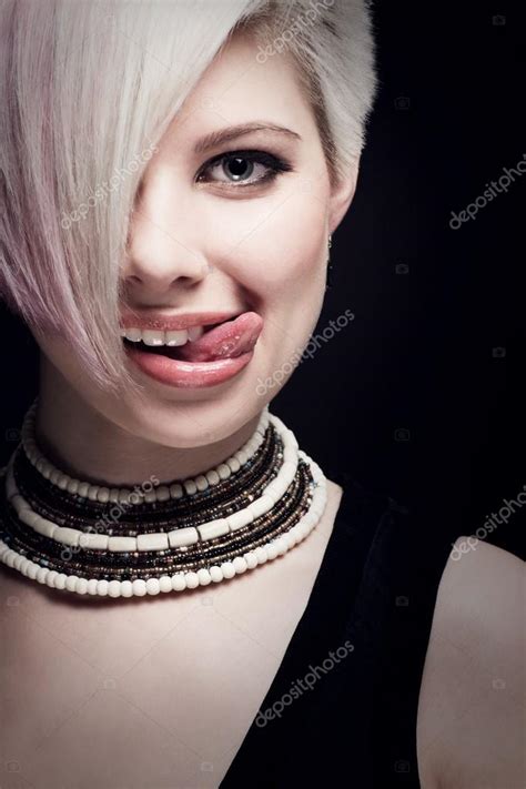 Beautiful Young Woman With Her Tongue Out — Stock Photo © Kjekol 28027187