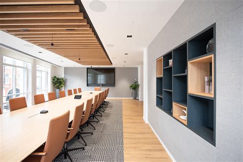 Boardroom Design With Natural Materials Including Feature Shelving And