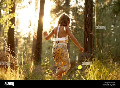 Girl Walking In The Woods Stock Photo Alamy