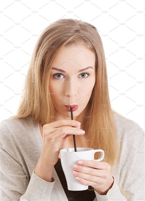 Beautiful Woman Is Drinking From A Cup With Straw People Images
