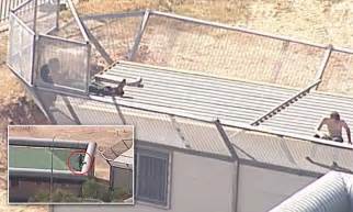 inmates climb onto roof at brisbane detention centre