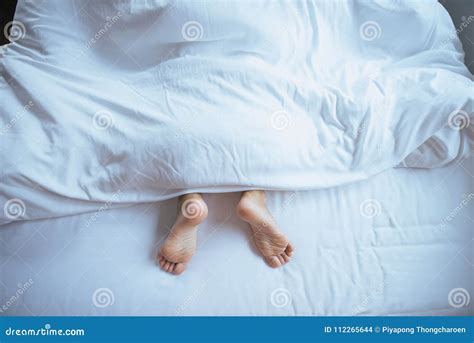 Barefoot And Leg Under Blanket On The Bed Stock Photo Image Of Human