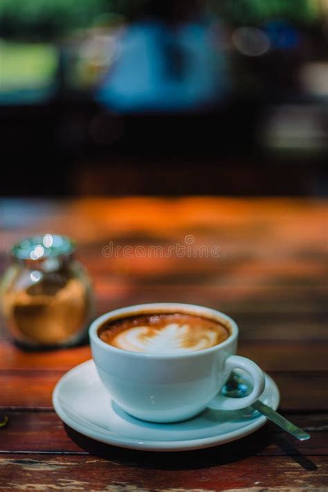 Hot Coffee Latte Cappuccino Spiral Foam On Wooden Table In Coffe Stock
