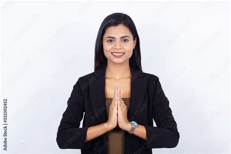 Confident Young Indian Businesswoman Greeting Namasthe On White