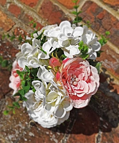 All the blossoms are so round and full that it is hard to tell where one ends and the next begins, and the effect is absolutely stunning. Mix of peonies and hydrangeas all artificial to create ...