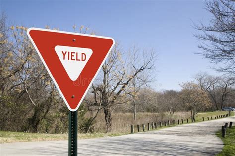 Yield Sign In A Park With Clear Blue Sky Stock Image Image Of