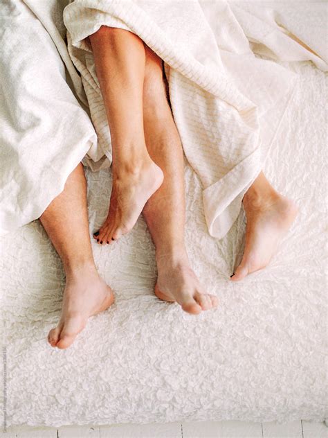 legs of couple in bed by stocksy contributor dreamwood photography stocksy