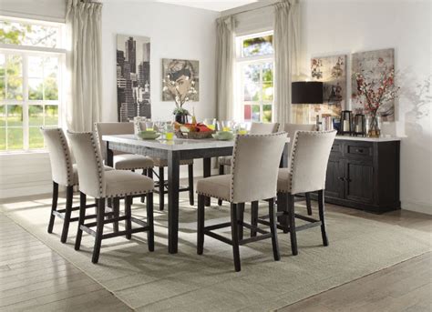 • iron legs and frame in a white… Nolan White Marble Top Counter Height Dining Table