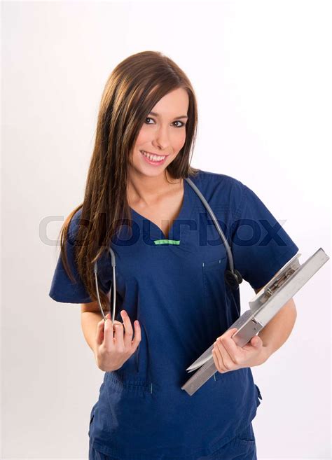 Beautiful Brunette Nurse Holds Patient Medical Chart Data In Clipboard