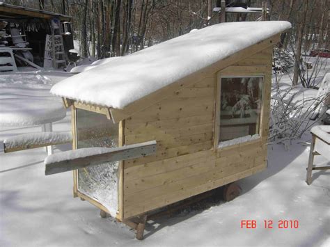 Featuring a covered front porch, stone fireplace, loft, and a cozy interior. Derek Diedricksen's $200 Hickshaw Micro Cabin (Circa 2010)